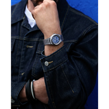 Load image into Gallery viewer, Person wearing a watch on a blue background