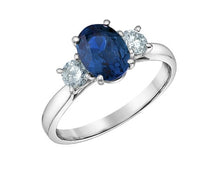 Load image into Gallery viewer, White gold ring with a blue gemstone and two smaller clear stones on a white background