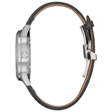 Load image into Gallery viewer, Close-up of a watch with a black leather strap and silver case on a white background