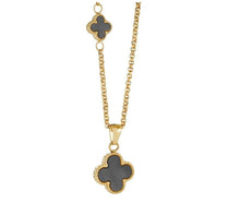 Load image into Gallery viewer, Gold plated necklace with black clover pendants on a white background