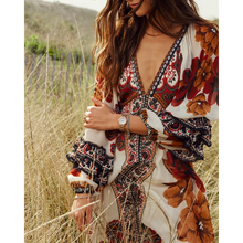 Load image into Gallery viewer, Woman wearing a floral dress in a field