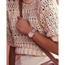 Load image into Gallery viewer, Close-up of a person wearing a rose gold watch on a textured beige sweater.