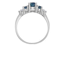Load image into Gallery viewer, White gold ring with blue gemstones in profile on a white background