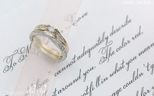 Load image into Gallery viewer, Gold ring on a piece of paper with cursive writing