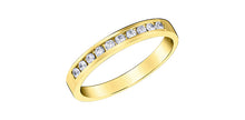 Load image into Gallery viewer, Gold ring with embedded diamonds on a white background