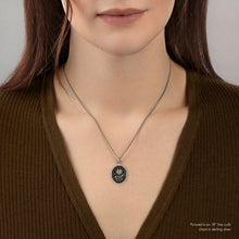 Load image into Gallery viewer, Person wearing a necklace with a pendant on a plain background