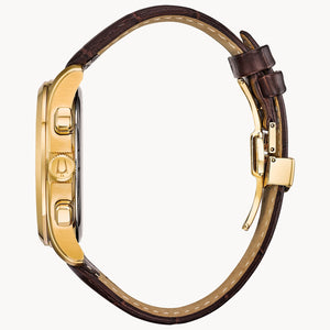 Gold watch with brown leather strap on a white background