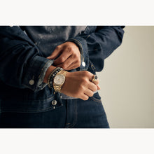 Load image into Gallery viewer, Person wearing a gold watch and bracelets on a neutral background
