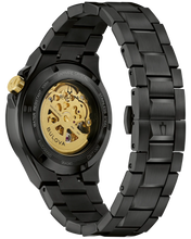 Load image into Gallery viewer, A Bulova automatic watch with a black stainless steel link bracelet and a black case, showing a gold-tone mechanical movement through the transparent back cover.
