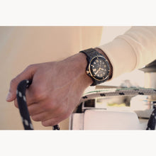 Load image into Gallery viewer, Hand wearing a watch with a blurred background
