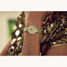 Load image into Gallery viewer, Gold watch on a wrist with a sequined gold dress in the background
