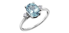 Load image into Gallery viewer, White Gold ring with a large blue gemstone and smaller diamonds on a white background in Kamloops BC
