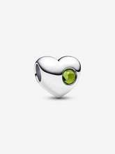 Load image into Gallery viewer, Heart-shaped silver charm with a light green gemstone on a white background
