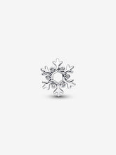 Load image into Gallery viewer, Silver snowflake-shaped charm with embedded stones on a white background
