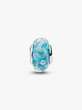 Load image into Gallery viewer, Blue glass charm with silver accents on a white background
