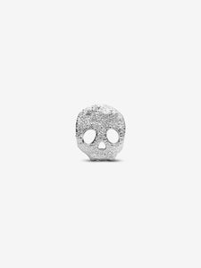Silver skull-shaped pendant on a white background