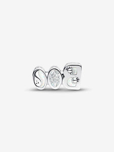 Silver charm with halloween design on a white background