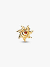 Load image into Gallery viewer, Gold sun-shaped charm with a red gemstone on a white background

