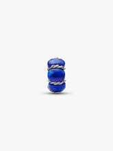 Load image into Gallery viewer, Blue and silver charm on a white background
