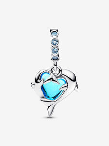 Silver pendant with blue heart and clear stones on a white background