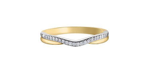Gold and white gold ring with diamond accents on a white background