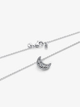 Load image into Gallery viewer, Silver necklace with a crescent moon pendant on a white background
