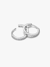 Load image into Gallery viewer, Pair of silver hoop earrings set with CZ on a white background

