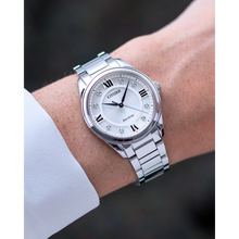 Load image into Gallery viewer, Silver Citizen watch on a wrist with a blurred background
