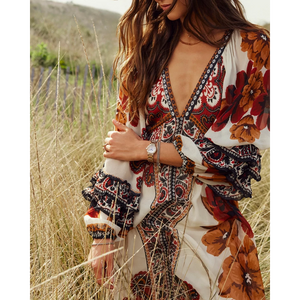 Woman wearing a floral dress in a field