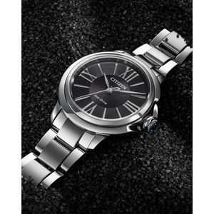 Silver Citizen watch with black dial on a dark textured background