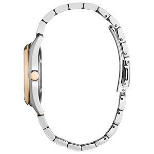 Close-up of a silver watch with a rose gold accent on a white background