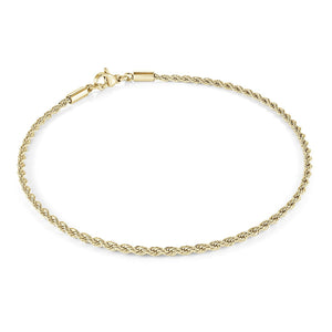 Gold rope chain bracelet on a white background