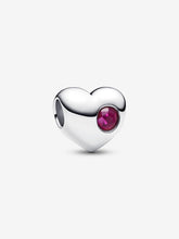 Load image into Gallery viewer, Heart-shaped silver charm with a red gemstone on a white background
