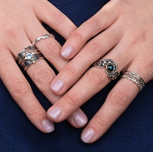 Load image into Gallery viewer, Close-up of hands wearing multiple rings on a dark background
