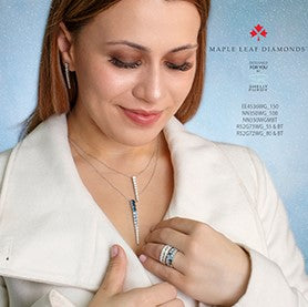 Woman wearing jewelry with a blue background