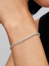 Load image into Gallery viewer, Silver bracelet on a person&#39;s wrist against a neutral background
