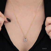Load image into Gallery viewer, Gold necklace with a diamond pendant being adjusted on a person's neck.
