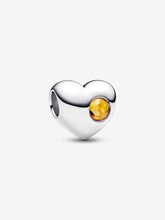 Load image into Gallery viewer, Heart-shaped silver charm with a yellow gemstone on a white background
