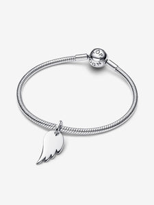 Silver bracelet with a angel wing-shaped charm on a white background