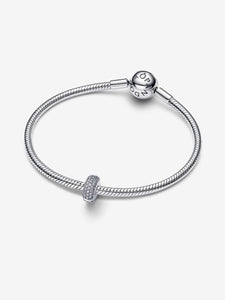 Silver bracelet with a clasp on a white background