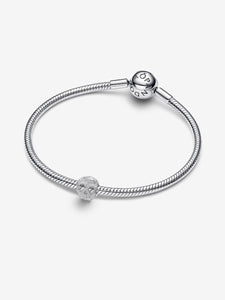 Silver bracelet with a matching charm on a white background