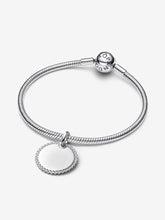 Load image into Gallery viewer, Silver bracelet with a round charm on a white background
