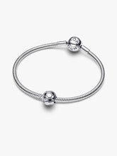 Load image into Gallery viewer, Silver bracelet with a soccer ball charm on a white background
