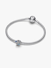 Load image into Gallery viewer, Silver bracelet with a shell shaped charm on a white background
