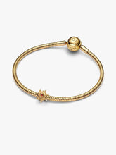 Load image into Gallery viewer, Gold bracelet with a charm on a white background
