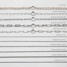 Load image into Gallery viewer, Collection of various silver chain necklaces on a white background with labels.
