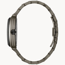Load image into Gallery viewer, Close-up of a watch with a metallic band on a white background

