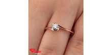 Load image into Gallery viewer, Rose gold ring with a diamond on a hand
