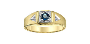 Gold ring with a central blue gemstone and triangular diamond accents on a white background
