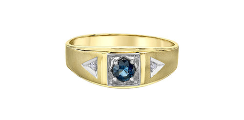 Gold ring with a blue gemstone and triangular designs on a white background Fifth Avenue Jewellers Kamloops BC